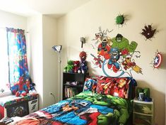 a bed room with a neatly made bed next to a book shelf and window filled with toys