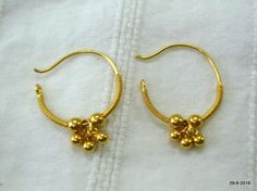 traditional design 20kt gold hoop earring pair from rajasthan india. nice handmade design made of 20kt yellow gold, good for jewellery collection. weight - 1.1 grams size - 1.8/1.4 cm material - 20kt yellow gold. Gold Plug Earrings For Festivals, Traditional 22k Gold Hoop Earrings, Traditional Small Hoop Gold Plated Earrings, Traditional Small Hoop Gold Earrings, Traditional Gold Hoop Nose Rings, Handmade Gold Earrings For Puja, Traditional Small Hoop Hallmarked Earrings, Traditional Small Hoop 22k Gold Earrings, 22k Gold Temple Jewelry Hoop Earrings