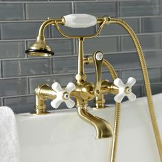 a bathtub faucet with two handset spouting water