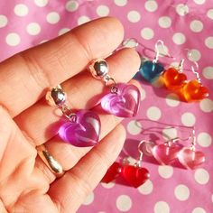 Kawaii candy heart earringsChoice of 8 cute coloursMade from a see through resin that has a glowing look in the lightChoice of silver plated fasteningsSo kawaii! Hearts measure 1.5cmDrop depends on finishModel @siljasailor Plastic Heart Beads Jewelry For Gifts, Multicolor Heart-shaped Kawaii Jewelry, Kawaii Multicolor Heart-shaped Jewelry, Kawaii Candy, Crescent Moon Earrings, Red Orange Yellow, Pearl Hoop Earrings, Heart Candy, Moon Earrings