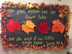 a bulletin board with fall leaves and the words, the grass witches and the flower fadess but the word of our lord stands forever