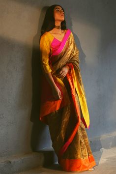 Antique gold tissue saree with multi-color silk panels and striped detail. Comes with colorblock blouse.
Component: 2
Neckline: V Neck
Sleeve Length: Three Quarter
Fabric: Handloom Tissue, Silk
Color: Gold
Panelled detail
Colorblock blouse - Aza Fashions Shorshe Clothing, Patch Blouse, Cotton Saree Designs, Tissue Saree, Saree For Women, Gold Blouse, Silk Organza, Saree With Blouse, Blouse Online