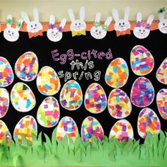 an egg - shaped bulletin board decorated with easter eggs