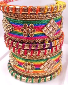 Colourful set of handmade bangles set with champagne coloured kundan stones. They will fit right in with any of your outfits 10 bangles per set Available in following sizes 2.4 (2.25 inches inner diameter) 2.6 (2.37 inches inner diameter) 2.8 (2.5 inches inner diameter) 2.10 Bangles shipped will be as shown in the picture, however actual colours may vary slightly from those shown due to the nature of photographing and colour settings Luxury Multicolor Bangle For Festive Season, Luxury Multicolor Bangle As Gift, Bohemian Bangle For Festive Celebration, Festive Bohemian Bangle For Celebration, Multicolor Bangle Bracelets With Dori Work, Multicolor Bangle Bracelet With Dori Work, Diwali Party Bracelets With Zari Work, Festive Bangle With Stone Work For Celebration, Zari Work Bracelets For Diwali Party