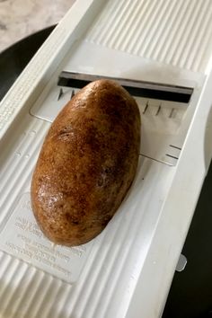 a baked potato sitting on top of a white tray