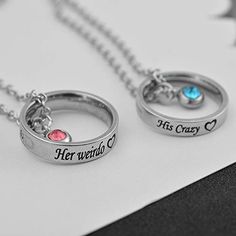 two personalized rings with names on them