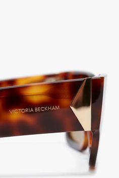 The sleek rectangular frame and wide temples of these V Plaque sunglasses create a confident silhouette. Crafted in Italy from acetate, they have a V metal insert on the temples and are designed in a luxurious shade of Tortoise for a contemporary point of difference. A gold-tone V plaque completes the look. Styled with the Sleeveless T-Shirt   Victoria Beckham V Plaque Rectangular Frame Sunglasses In Tortoise  - Size ONE SIZE UK Modern Tortoiseshell Sunglasses For Formal Occasions, Formal Rectangular Acetate Sunglasses, Chic Rectangular Tortoiseshell Sunglasses, Classic Rectangular Acetate Sunglasses, Luxury Classic Tortoiseshell Sunglasses, Classic Tortoiseshell Rectangular Sunglasses, Luxury Modern Tortoiseshell Sunglasses, Luxury Tortoiseshell Sunglasses With Uv Protection, Luxury Tortoiseshell Sunglasses With Glass Lenses