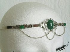 Green Agate Circlet This beautiful circlet has metal chain, sterling silver plated accents, sterling silver plated pendant and green agate settings. Adjustable. Elegant Handmade Silver Body Jewelry, Elegant Handmade Adjustable Body Jewelry, Elegant Handmade Metal Body Jewelry, Medieval Silver Wedding Jewelry, Adjustable Medieval Style Nickel-free Jewelry, Medieval Style Silver Wedding Jewelry, Silver Metal Crown-shaped Jewelry, Silver Crown-shaped Metal Jewelry, Silver Crown Shaped Metal Jewelry