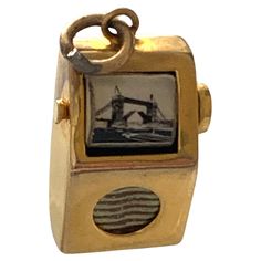 9ct Gold Television Charm with moving images that are rolled around (just two) They are printed on a roller I am not sure what the roller is made from appears to be ceramic Circa 1960s. Size 1.5mm x 8mm x 5mm Weight 1.72 grams Punch And Judy, Moving Images, Vintage Charm Bracelet, Pewter Color, Gold Box, Vintage Souvenir, Moving Image, Charm Rings, Smokey Quartz