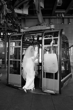 the bride is getting out of the train