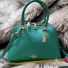 No Low Balling, Make Resonable Offers Only Coach (2553) Katy Satchel Handbag Brand New With Tags! 100% Authentic! Features: Detachable/Adjustable Crossbody Strap Inner Zip Pocket Outer Zip Pocket Zip Top Closure Color: Bright Jade Material: Crossgrain Leather Measures: 11.75" L X 4" W X 7.75" H Msrp: $350.00 Green Handbags, Dome Bag, Green Handbag, Satchel Handbag, Satchel Handbags, Branded Handbags, Zip Top, Crossbody Strap, Couture Fashion