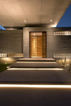 some steps leading up to a house with lights on them