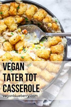 vegan tater tot casserole in a skillet with a spoon