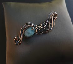 Handcrafted wire wrapped hair barrette  caribbean larimar gemstone, smooth, oval  copper wire wrap, oxidized for an antiqued finish, tumbled and polished  3" total length  snug fit clip  comes nicely packaged with a business card, jewelry care instructions and a polishing cloth Metal Wire Hair Wrap, Wire Hair Pin, Copper Wire Hair Accessories, Wire Wrapped Barrette, Blue Wire-wrapped Pendant Jewelry, Bijoux Fil Aluminium, Wire Wrapping Crystals, Jewelry Care Instructions, Hair Jewelry Wedding