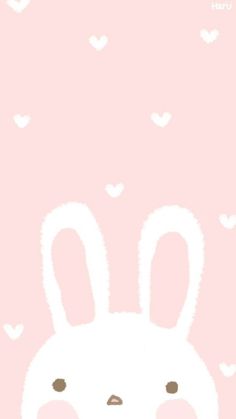 a pink background with an image of a white rabbit on it's face and hearts in the background