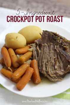 a white plate topped with meat, potatoes and carrots