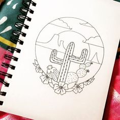 a drawing of a cactus and flowers in a circle