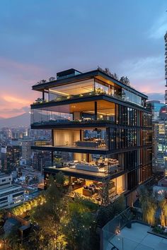 a tall building with lots of windows and balconies on the top of it