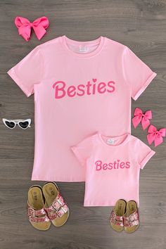 *Each top sold separately* Short sleeve design makes it a perfect pick all season long Mom top and child tops both feature a pink design with "Besties" across the front Ultra soft material for comfort & ease These "Besties" Pink Short Sleeve Tops feature short sleeves and a fun "Besties" design embossed on the front. In a versatile pink color, this top is made from soft and breathable fabric that will keep her comfy during all adventures. She can pair it with a variety of SIP bottoms & our booti Mommy And Me Matching Shirts, Mom And Me Shirts, Mom Daughter Outfits, Daughter Outfits, Sparkle In Pink, Old Outfits, Short Sleeve Design, Children Top, Diy Fashion Hacks