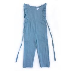 Introducing our must-have piece for the warmer seasons - the Medium Blue Linen Ruffle Romper with Pants. Made from high-quality linen fabric, this romper exudes effortless style and comfort. The functional buttons in the back and waist tie add a touch of functionality to this chic piece. Perfect for any occasion, this romper fits true to size and will become a staple in your wardrobe. Welcome spring and summer with this versatile and stylish romper, available now on our e-commerce store.