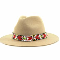 Dress up any hat with this western beaded leather hat band. Beautiful native patterns with vibrant colors. Bring a southern charm to your old favorites with this gorgeous hat band or make your new hat even more special. Made of full grain leather (highest grade leather) and glass beads. Handmade in Brazil by artisan women. You can match your hat band with our best-selling leather beaded dog collars! Treated with beeswax, water resistant. 30 days free returns or exchange. 1-year warranty. One siz Southwestern Style Hat Bands For Festival With Flat Crown, Southwestern Hat Bands For Festival With Flat Crown, Adjustable Bohemian Hat Bands For Ranch, Southwestern Multicolor Hat Band For Country Events, Handmade Southwestern Multicolor Hat Band, Artisan Multicolor Hat Bands For Country Events, Southwestern Style Hat Bands For Rodeo With Flat Crown, Handmade Bohemian Hat Bands For Western-themed Events, Southwestern Flat Crown Hat Bands For Rodeo