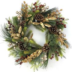 a christmas wreath with pine cones, berries and other greenery is displayed on a white background