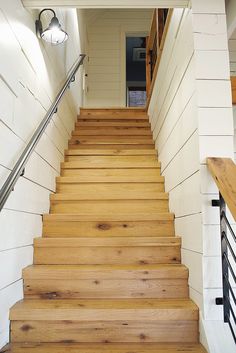 a set of wooden stairs leading up to a door