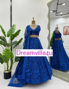 Lehenga: Fabric: Faux Georgette Work: Sequins with thread Size: Up to 44 (semi-stitched) Inner: Microfiber Type: Semi-Stitched Flair: 3.4 meters, with cancan and canvas Choli: Fabric: Faux Georgette Inner: Microfiber Work: Sequins with thread Size: Up to 44 (unstitched) Dupatta: Fabric: Butterfly Net Work: Sequins with thread, four-side cut lace border Weight: 1.5 kg Bollywood Style Net Sets For Wedding, Wedding Net Sets For Eid, Bollywood Style Wedding Net Sets, Bollywood Style Wedding Sets In Net, Bollywood Net Wedding Sets, Fitted Net Choli For Wedding, Fitted Net Sets For Wedding, Anarkali Style Blue Lehenga In Net Material, Bollywood Style Wedding Choli In Net