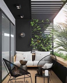 an outdoor living area with black and white furniture, potted plants on the balcony