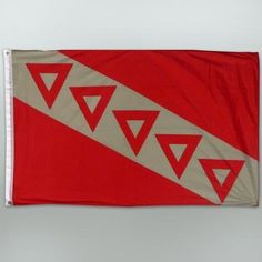 a red and white flag with triangles on it