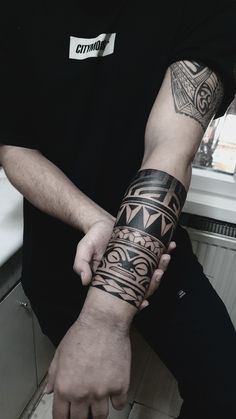 a man with a tattoo on his arm