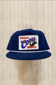 BRAND NEW Coors Original Rodeo Patch on Navy Blue Corduroy Hat Rope with Snapback 🧢 HIGH-QUALITY HAT 🧢 🤚 HANDMADE!! BRAND NEW (shipping is high to cover shipping and the handmade process) ❤️Support small businesses❤️ FAST COMMUNICATION & FAST ON-TIME SHIPPING CHECK OUT MY PROFILE FOR MORE HATS & OTHER UNIQUE & VINTAGE STYLE ITEMS. Vintage Rope Hats, Vintage Corduroy Hat, Vintage Apparel, Hats For Boyfriend, Branded Clothing, Vintage Snapback, Men’s Hat, Trucker Hat Style, Cool Hats For Men