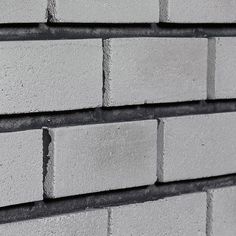 a close up of a white brick wall