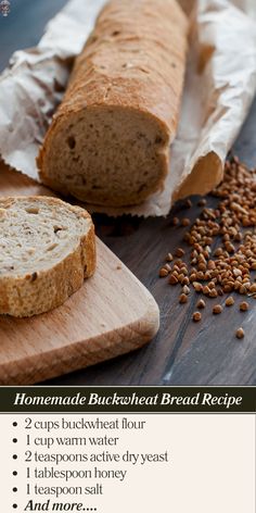 a loaf of bread sitting on top of a wooden cutting board next to some seeds