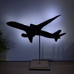 a model airplane on display in front of a wall