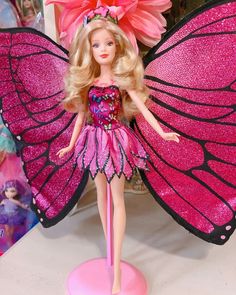 a barbie doll dressed as a butterfly with pink wings