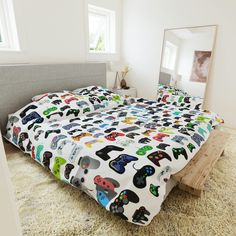 a bed with video game themed sheets on it