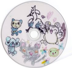 a white cd with various stickers on it