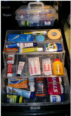 an organized drawer filled with different types of toothpaste and dental care products in plastic containers