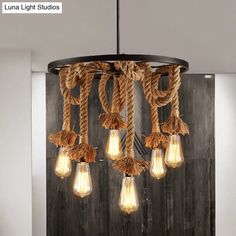 a light fixture with rope and bulbs hanging from it