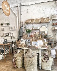 a room filled with lots of baskets and furniture