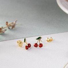 14K Solid Gold Cherry Earrings, Dainty Red Cherries Earrings, Cute Minimalist Fruit Earrings, Tiny Summer Jewelry, Gİft For Her The material is 14k solid gold (not gold filled or gold plated). M o r e * F r o m * U s Goldstore Jewelry - https://etsy.me/3gHtcrZ * Editor's Pick - https://etsy.me/3CCLlmm * Cremation Urn Jewelry - https://etsy.me/3MM0Lcq * Stud Eearrings - https://etsy.me/3t4ZhlR * Diamond Earring - https://etsy.me/3i2NzCc * Birthstone Earring - https://etsy.me/3tYzWcO * Evil Eye Ea Cherry Colored Earrings Gift, Dainty Handmade Red Earrings, Cherry Color Earrings For Valentine's Day Gift, Small Red Jewelry Perfect For Gifting, Cherry Earrings For Valentine's Day Gift, Cherry Colored Earrings For Valentine's Day Gift, Small Red Jewelry For Gift, Red Hypoallergenic Dainty Earrings, Red Dainty Earrings For Anniversary