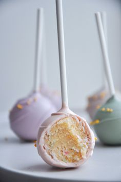 three different types of cake pops on a table