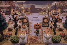 a table with pumpkins and candles on it