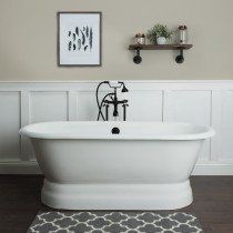 a white bath tub sitting on top of a hard wood floor next to a wall