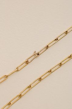 A bold paperclip style chain with elongated oval links. The gold fill Paperclip Chain features a bespoke hand-wrought clasp with a generous clearance, designed to visually match the other links. This clasp allows the wearer to attach a charm to the necklace without interrupting its natural rhythm, as well as wear the chain at a shorter length when desired. Last two images show our Paperclip Chain Necklace, Margaux Necklace and Roma Link Bracelet on Claire Danes in Hulu's 'Fleishman is in Trouble Gold-tone Gold-plated Necklace With Paperclip Chain, Gold-tone Metal Necklace With Paperclip Chain, Elegant Gold-tone Paperclip Chain Necklace, Elegant Gold-tone Paperclip Necklace, 14k Gold-tone Paperclip Chain Necklace, Claire Danes, Charm Holder, Gold Filled Chain, Paper Clip