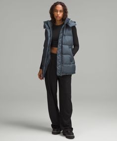 This Wonderfully Warm Down Puffer Has A Cinchable Waist And Hem That Lets You Customize The Shape And Keep Out Cold Drafts. Designed For Casual. Relaxed Fit Feels Roomy And Can Be Worn Over Larger Layers. Size Down If You Prefer A Slimmer Fit. Zippered Exterior Pockets With A Hidden Phone Sleeve. Interior Pockets Hold The Essentials. Removable Hood. Cinch The Interior Waist And Hem Drawcord To Customize Your Fit. | Wunder Puff 600-Down-Fill Mid-Length Vest Belgian Blue, Warm Down, Vest Designs, Women's Coats & Jackets, Women's Coats, Coats Jackets Women, Womens Vest, Long Tops, Short Tops