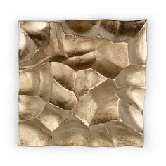 a square metal wall sculpture with rocks on it