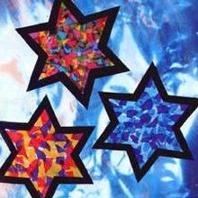 three colorful stars on a blue background