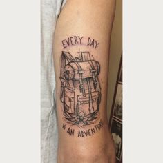 a man with a tattoo on his arm saying every day is an adventure